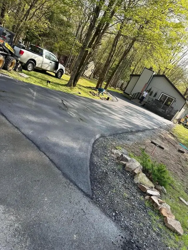 Asphalt driveway with stone border